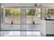Inviting covered patio featuring stylish furniture and large sliding glass doors, ideal for indoor-outdoor living at 18263 Ohara Dr, Port Charlotte, FL 33948