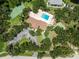Aerial view of community amenities featuring swimming pool, tennis court, pickle ball, and manicured lawns at 20016 Sancraft Ave, Port Charlotte, FL 33954