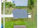 Bird's-eye view showcasing a well-maintained single-Gathering home with new roof, bordered by vibrant green landscaping at 20016 Sancraft Ave, Port Charlotte, FL 33954