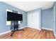 Serene bedroom with wood floors, natural light, and spacious closet at 20016 Sancraft Ave, Port Charlotte, FL 33954