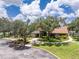 Charming community building with well-maintained landscaping, mature trees, and inviting entrance at 20016 Sancraft Ave, Port Charlotte, FL 33954