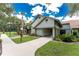 Exterior view of community building featuring a covered entrance and well-maintained landscaping at 20016 Sancraft Ave, Port Charlotte, FL 33954