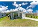 Charming single-story home with well-manicured lawn, and colorful landscaping at 20016 Sancraft Ave, Port Charlotte, FL 33954