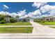 Exterior view of home with neat lawn and front yard landscaping at 20016 Sancraft Ave, Port Charlotte, FL 33954