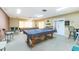 Bright game room featuring two pool tables and ample seating for entertainment at 20016 Sancraft Ave, Port Charlotte, FL 33954