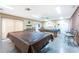 Spacious game room featuring two pool tables under bright, modern lighting fixtures at 20016 Sancraft Ave, Port Charlotte, FL 33954