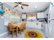 Bright eat-in kitchen with white cabinetry and modern appliances at 20016 Sancraft Ave, Port Charlotte, FL 33954