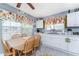Bright eat-in kitchen with white cabinetry and modern appliances at 20016 Sancraft Ave, Port Charlotte, FL 33954