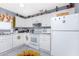 Bright eat-in kitchen with white appliances at 20016 Sancraft Ave, Port Charlotte, FL 33954