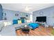 Charming living room with wood floors, large sectional, and bright natural light at 20016 Sancraft Ave, Port Charlotte, FL 33954