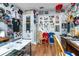 Eclectic office space featuring laminate wood flooring, white walls, and plenty of sports memorabilia at 20016 Sancraft Ave, Port Charlotte, FL 33954