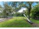 Community playground area with swings and a slide, perfect for outdoor activities and fun at 20016 Sancraft Ave, Port Charlotte, FL 33954
