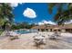 Enjoy the large community pool and exterior seating area on a beautiful Florida day at 20016 Sancraft Ave, Port Charlotte, FL 33954