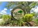 Charming Oak Hollow Recreation Center sign amidst lush foliage on a sunny day at 20016 Sancraft Ave, Port Charlotte, FL 33954