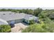 An eye-level full exterior home view highlighting the two-car garage and beautiful landscaping at 2024 Royal Tern Cir, Punta Gorda, FL 33983