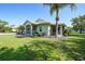 Charming single-story home featuring a screened-in porch and a well-maintained lawn at 2024 Royal Tern Cir, Punta Gorda, FL 33983