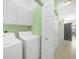 Bright laundry room featuring modern appliances and ample storage cabinets at 2024 Royal Tern Cir, Punta Gorda, FL 33983
