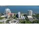 Expansive aerial shot of bayfront condos featuring a swimming pool, pristine landscaping, and convenient parking facilities at 2401 Bayshore Blvd # 1204, Tampa, FL 33629