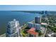 Beautiful aerial shot featuring bay view, modern condos, and tropical landscaping offers luxury waterfront living experience at 2401 Bayshore Blvd # 1204, Tampa, FL 33629
