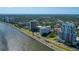 Overhead shot of waterfront condos offering views of scenic bay, with mature landscaping, a pool, and convenient highway access at 2401 Bayshore Blvd # 1204, Tampa, FL 33629