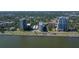 Captivating aerial view of luxurious waterfront condos with lush greenery, offering tranquil living by the scenic bay waters at 2401 Bayshore Blvd # 1204, Tampa, FL 33629
