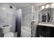 Updated bathroom features marble tiling, a jacuzzi tub, and sleek vanity at 2401 Bayshore Blvd # 1204, Tampa, FL 33629