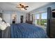 This primary bedroom features a ceiling fan, and ensuite bathroom, and a gorgeous view at 2401 Bayshore Blvd # 1204, Tampa, FL 33629