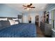 The sunlit primary bedroom features calming tones, a ceiling fan, and an ensuite bathroom at 2401 Bayshore Blvd # 1204, Tampa, FL 33629
