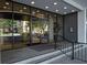 Glass doors at the building entrance, featuring a sleek design and signage at 2401 Bayshore Blvd # 1204, Tampa, FL 33629