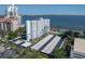 A clear view of the condo building, covered parking, and manicured landscaping at 2401 Bayshore Blvd # 1204, Tampa, FL 33629