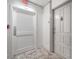 Hallway showing exit door and unit entrance with neutral-toned carpet at 2401 Bayshore Blvd # 1204, Tampa, FL 33629