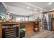 Kitchen features wine fridge and stainless refrigerator with island seating area at 2401 Bayshore Blvd # 1204, Tampa, FL 33629