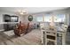 Cozy living and dining area with wood floors and balcony access showcasing bright natural light at 2401 Bayshore Blvd # 1204, Tampa, FL 33629