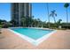 Large community pool with lush landscaping surrounding a high rise at 2401 Bayshore Blvd # 1204, Tampa, FL 33629