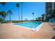 Resort-style pool is surrounded by palm trees with views of the beach at 2401 Bayshore Blvd # 1204, Tampa, FL 33629