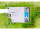 Aerial view of property showcasing pool, well-manicured landscaping, and spacious backyard at 24103 Pyramid Way, Punta Gorda, FL 33955