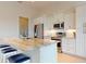 Beautiful kitchen featuring an island, stainless steel appliances, and custom cabinets at 24103 Pyramid Way, Punta Gorda, FL 33955