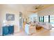 Bright living room featuring white furniture, high ceilings with a fan, and an open floor plan at 24103 Pyramid Way, Punta Gorda, FL 33955