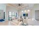 Bright living room with comfortable seating, a large TV, and access to the outdoor area at 24103 Pyramid Way, Punta Gorda, FL 33955