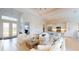 Bright living room with chef's kitchen and large front doors at 24103 Pyramid Way, Punta Gorda, FL 33955