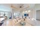 Airy living room featuring high ceilings, recessed lighting, and a wall of windows at 24103 Pyramid Way, Punta Gorda, FL 33955