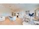 Open-concept living space with a kitchen island, dining area, and living room at 24103 Pyramid Way, Punta Gorda, FL 33955