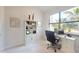 Home office with large window, computer desk and white cabinetry at 24103 Pyramid Way, Punta Gorda, FL 33955