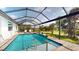 Beautiful pool area with a screened enclosure, perfect for enjoying the outdoors in comfort at 24103 Pyramid Way, Punta Gorda, FL 33955