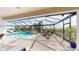 Inviting screened-in lanai with a private pool and ample seating area for relaxation at 24103 Pyramid Way, Punta Gorda, FL 33955