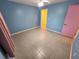 Bright bedroom with blue walls, tile floors, walk-in closet, and ceiling fan at 243 Harbor Blvd, Port Charlotte, FL 33954