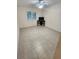 Bedroom featuring neutral tile floors, ceiling fan and window with bright light at 243 Harbor Blvd, Port Charlotte, FL 33954