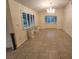 Bright dining area features large windows with shutters and a stylish chandelier for elegant meals at 243 Harbor Blvd, Port Charlotte, FL 33954