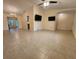Spacious living area boasting tile floors and multiple TVs, ready for entertaining at 243 Harbor Blvd, Port Charlotte, FL 33954