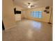 Bright living area with expansive tile floors, neutral walls and a large window for natural light at 243 Harbor Blvd, Port Charlotte, FL 33954
